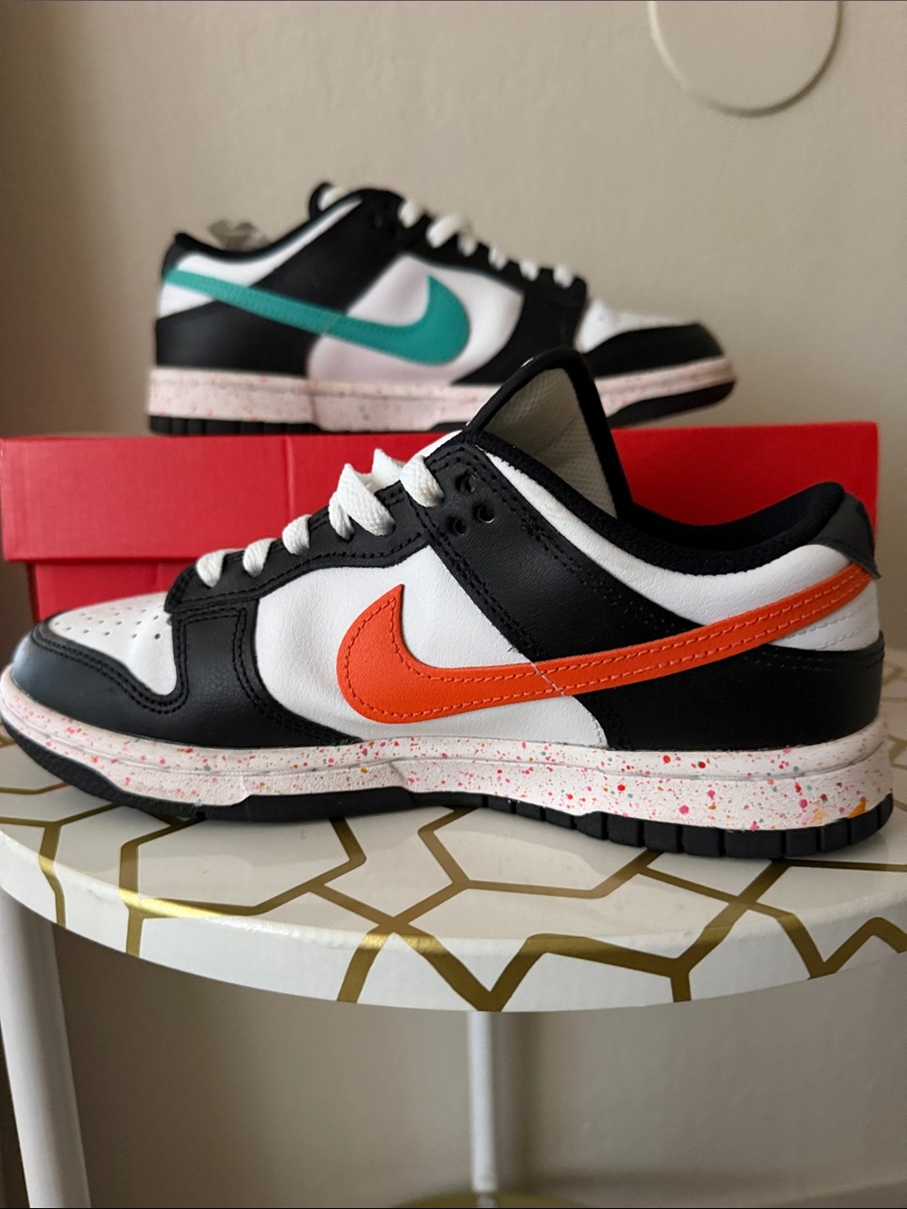 Nike Women’s Black & White Low-Top Sneakers with Orange Swoosh